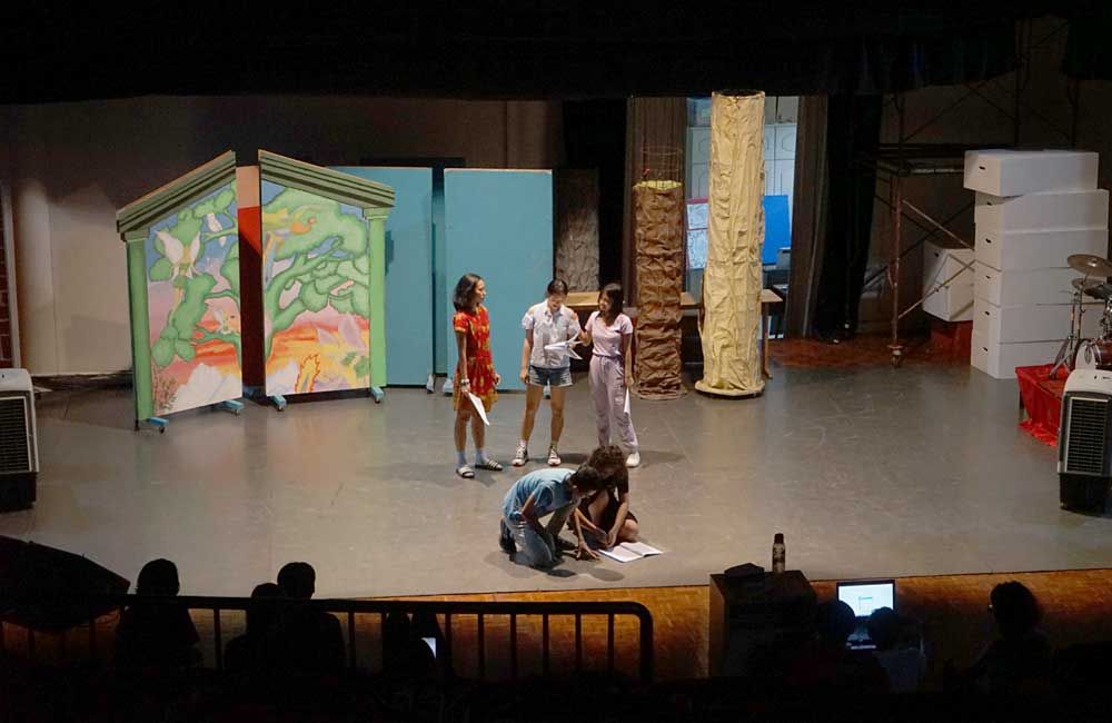 A group of people are standing on a stage.