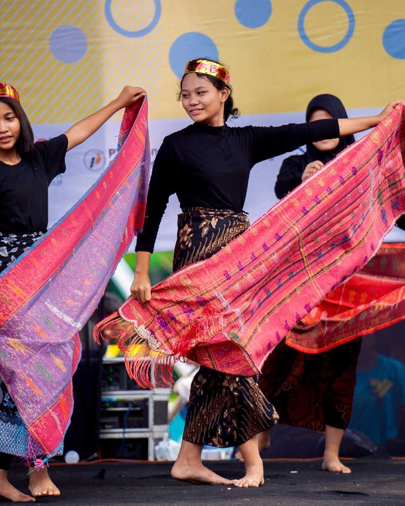 A group of young women are dancing on a stage
