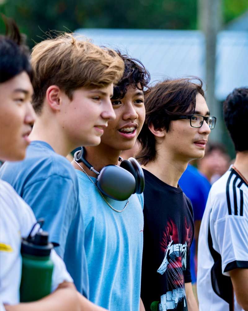 A group of young men are standing next to each other.