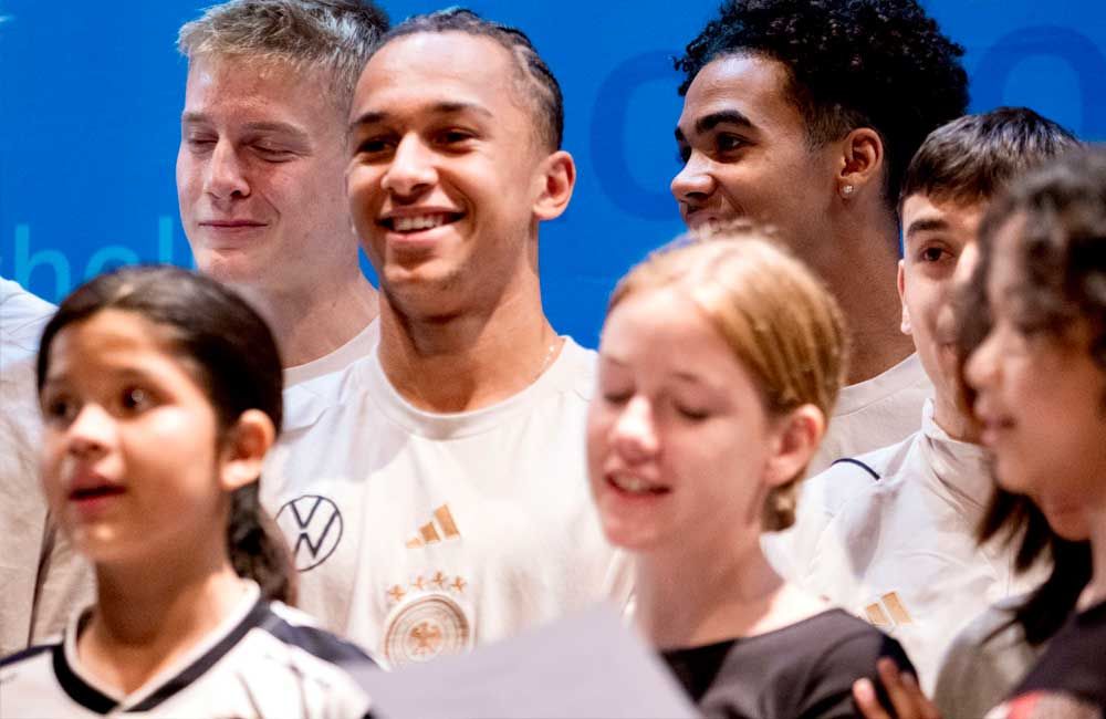 A group of young people are singing together in a choir.