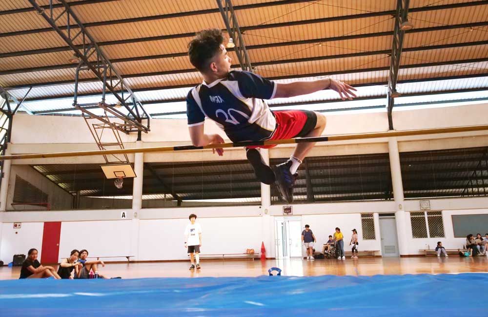 A man in a number 25 jersey is jumping in the air