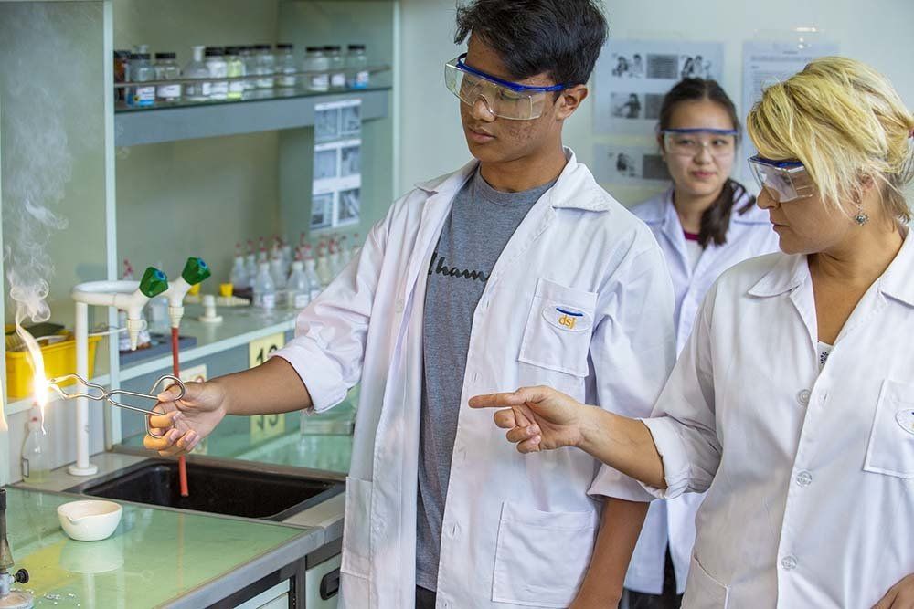 A group of people are working in a lab.