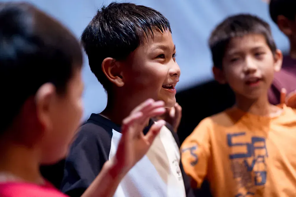 A boy wearing a shirt that says u.s.a. on it