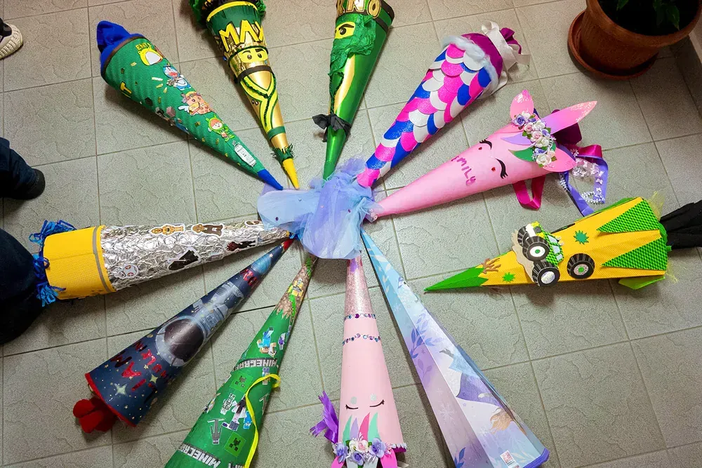 A bunch of cones are sitting in a circle on the floor