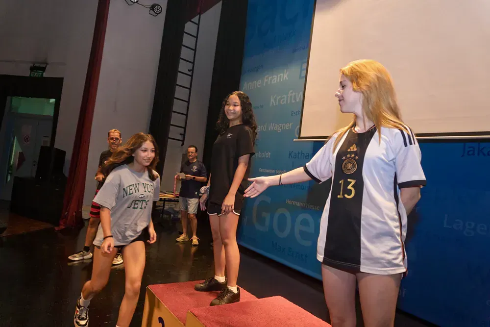 A girl wearing a jersey with the number 13 on it