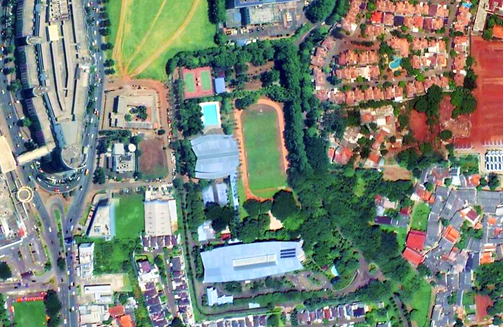 An aerial view of a city with a lot of buildings and trees.
