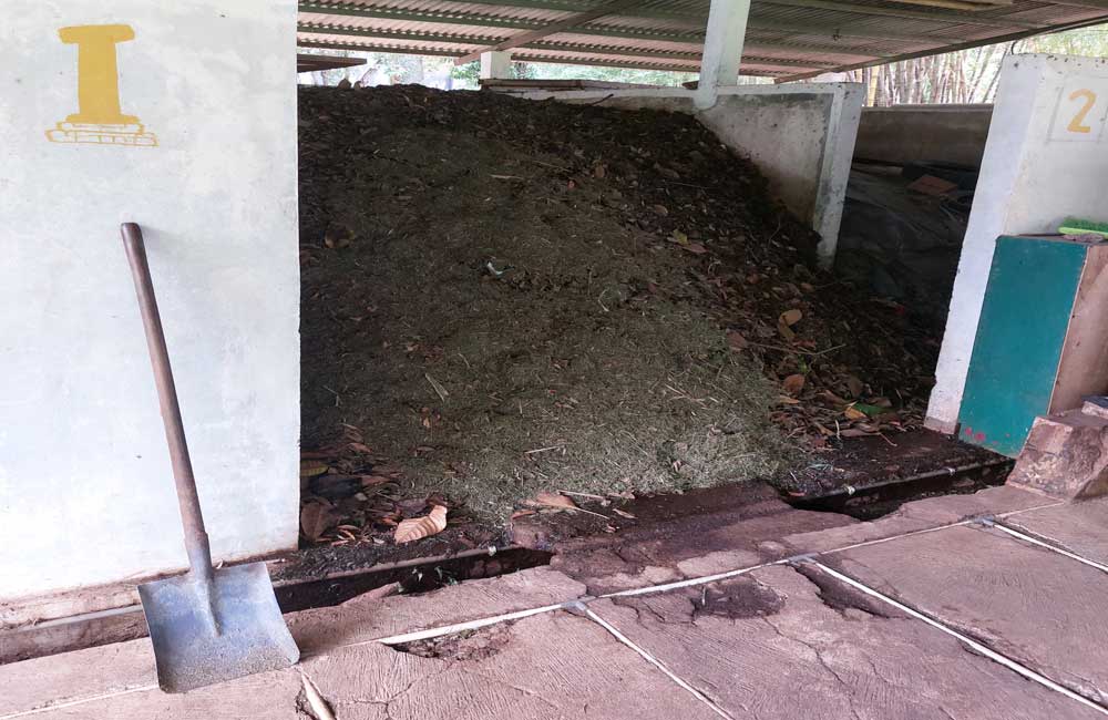 A shovel is sitting next to a pile of dirt.