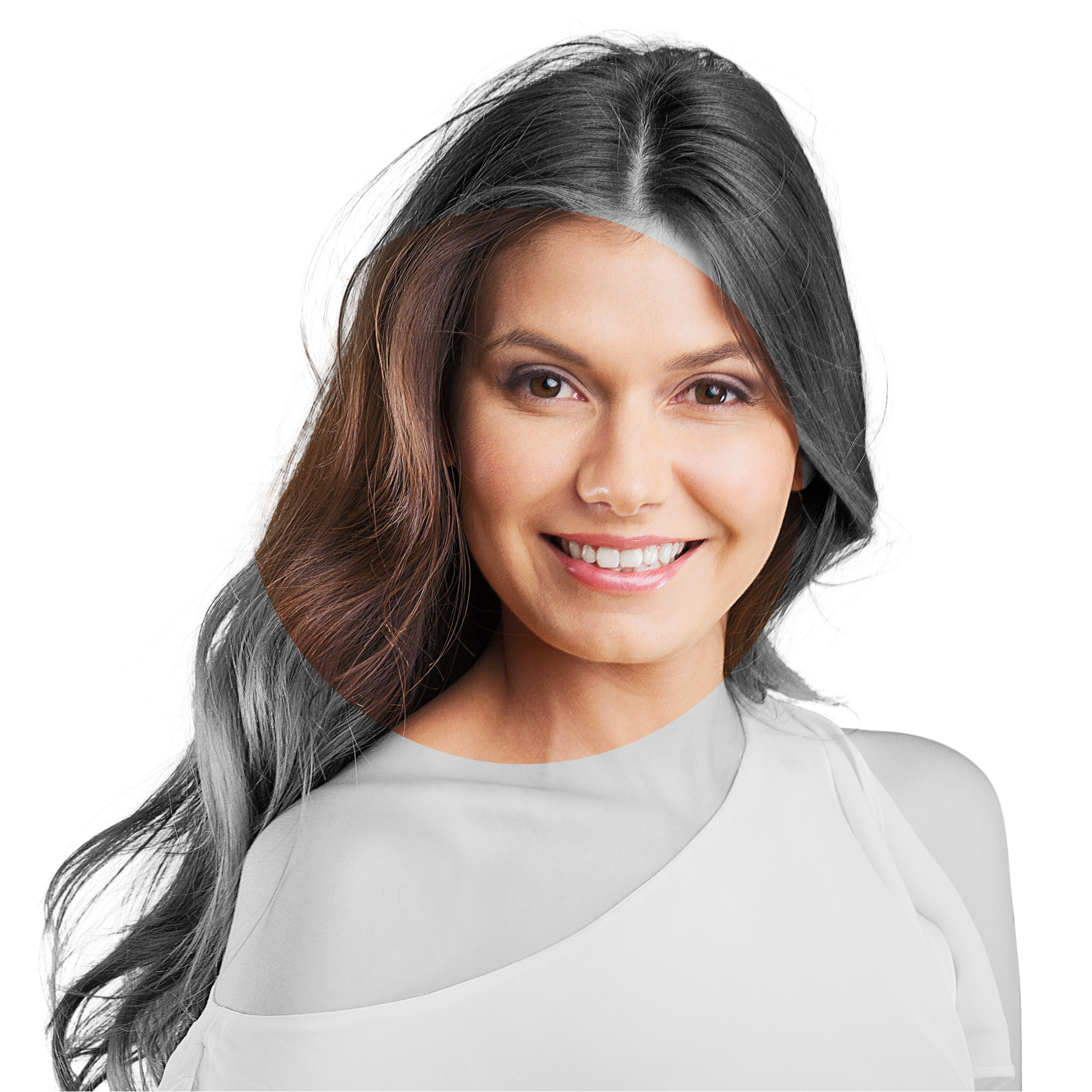 A woman with brown hair is smiling and wearing a white shirt.