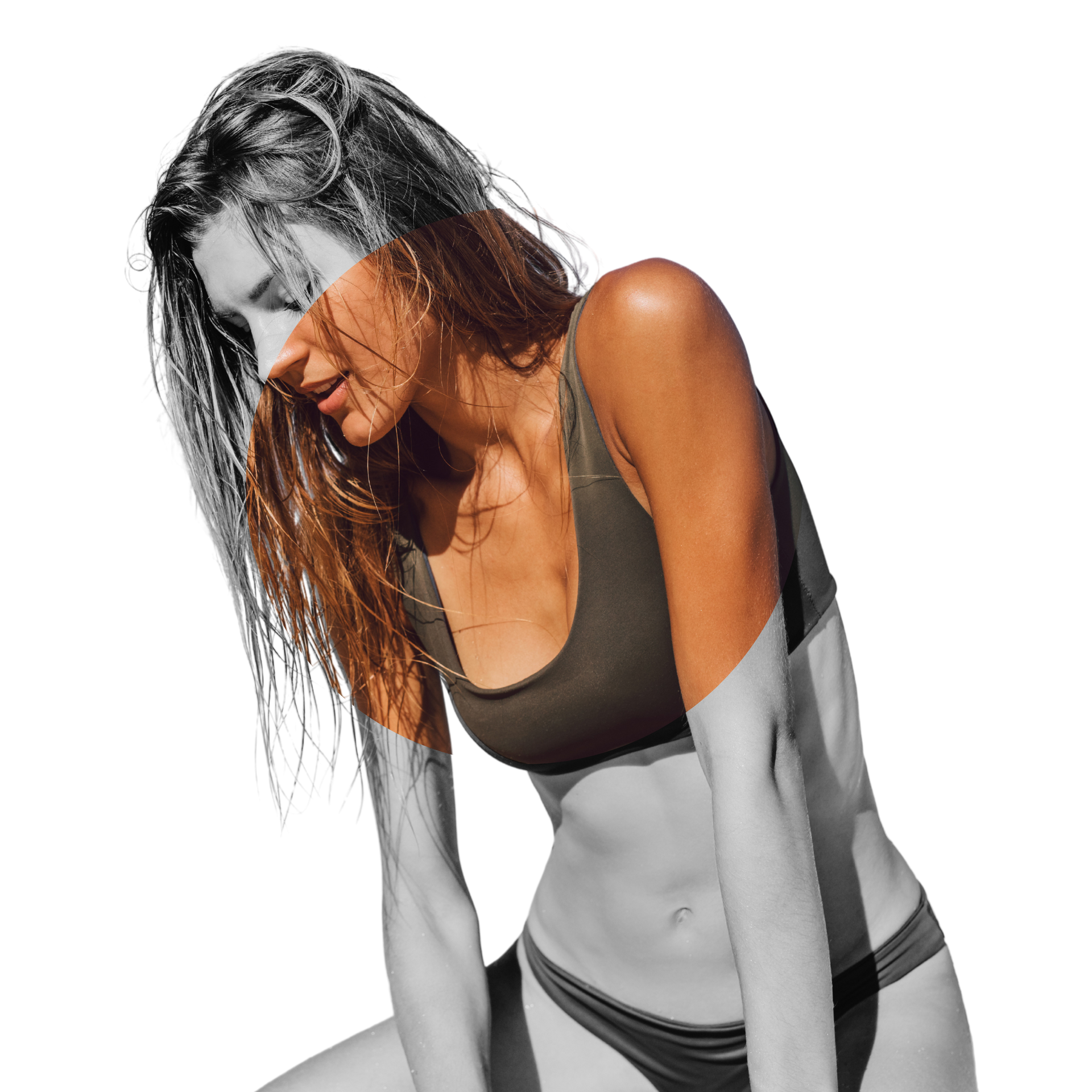 A woman in a bikini is sitting on the ground with her head down