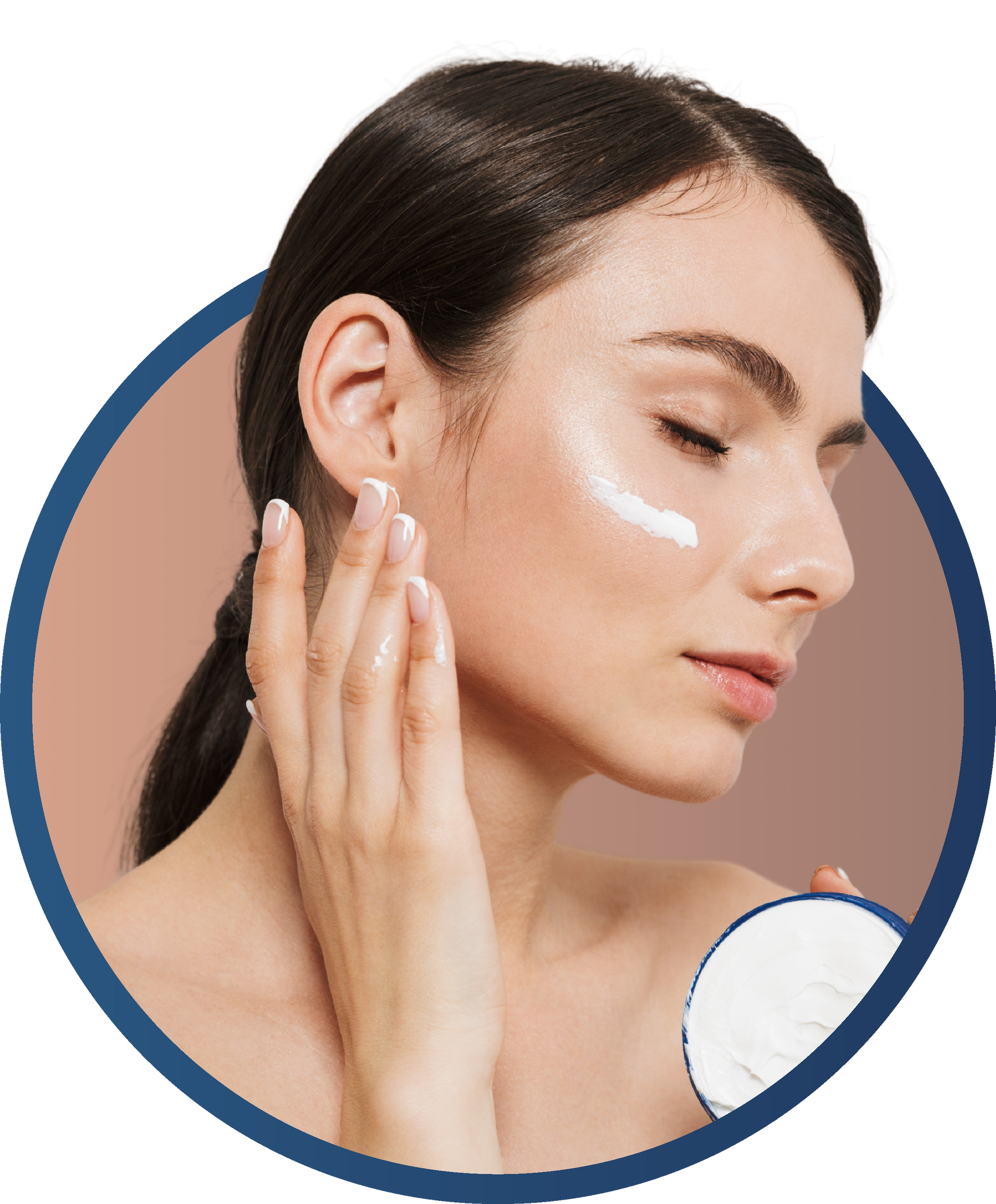 A woman is applying cream to her face.