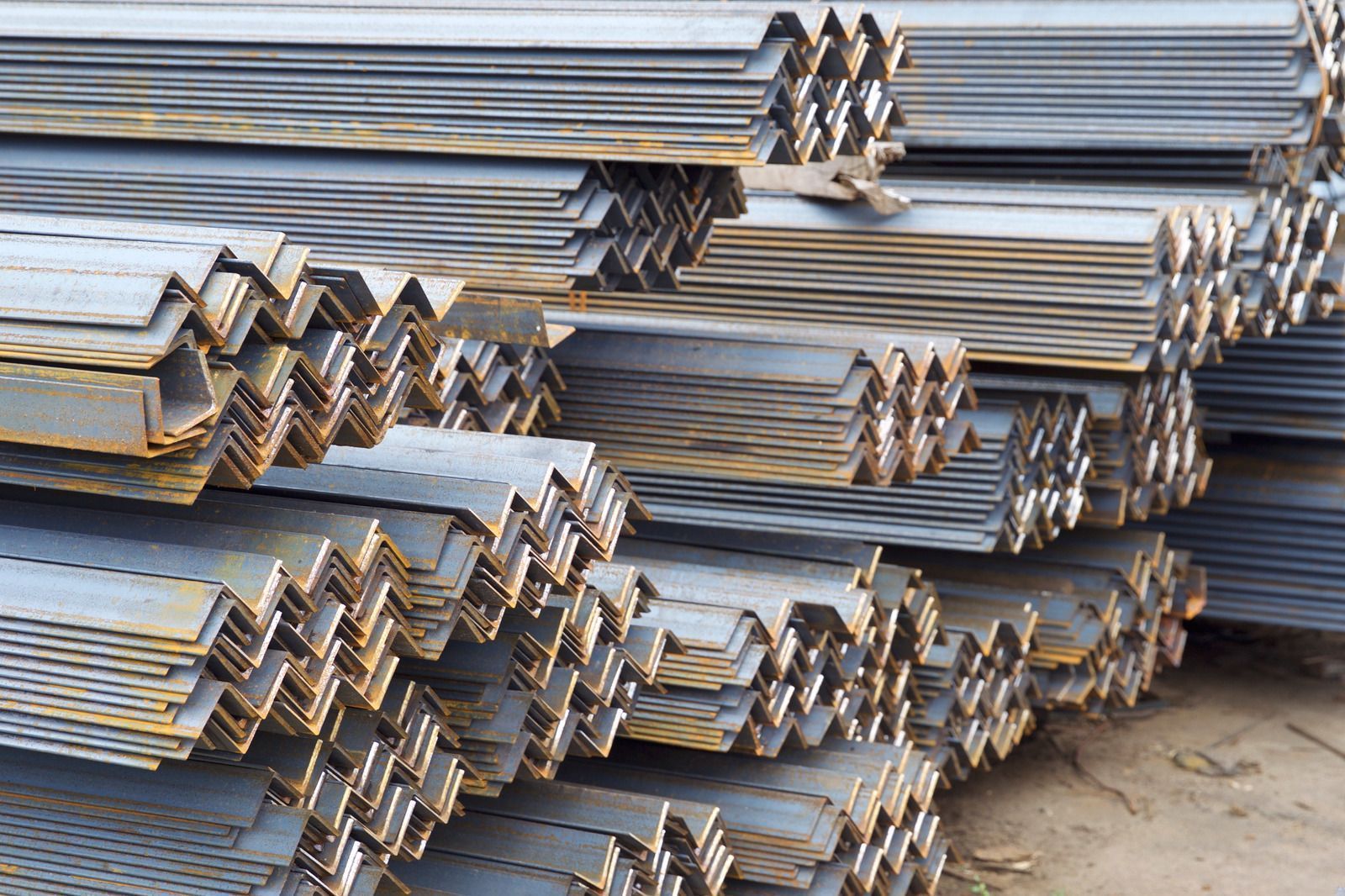 Stacks of angled steel beams.