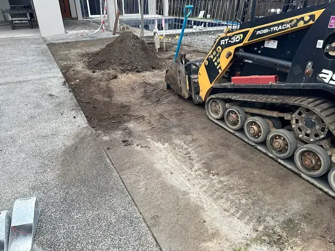 Excavator on a Pile of Dirt and Rocks — Cairns Earthmoving Solutions In Smithfield, QLD
