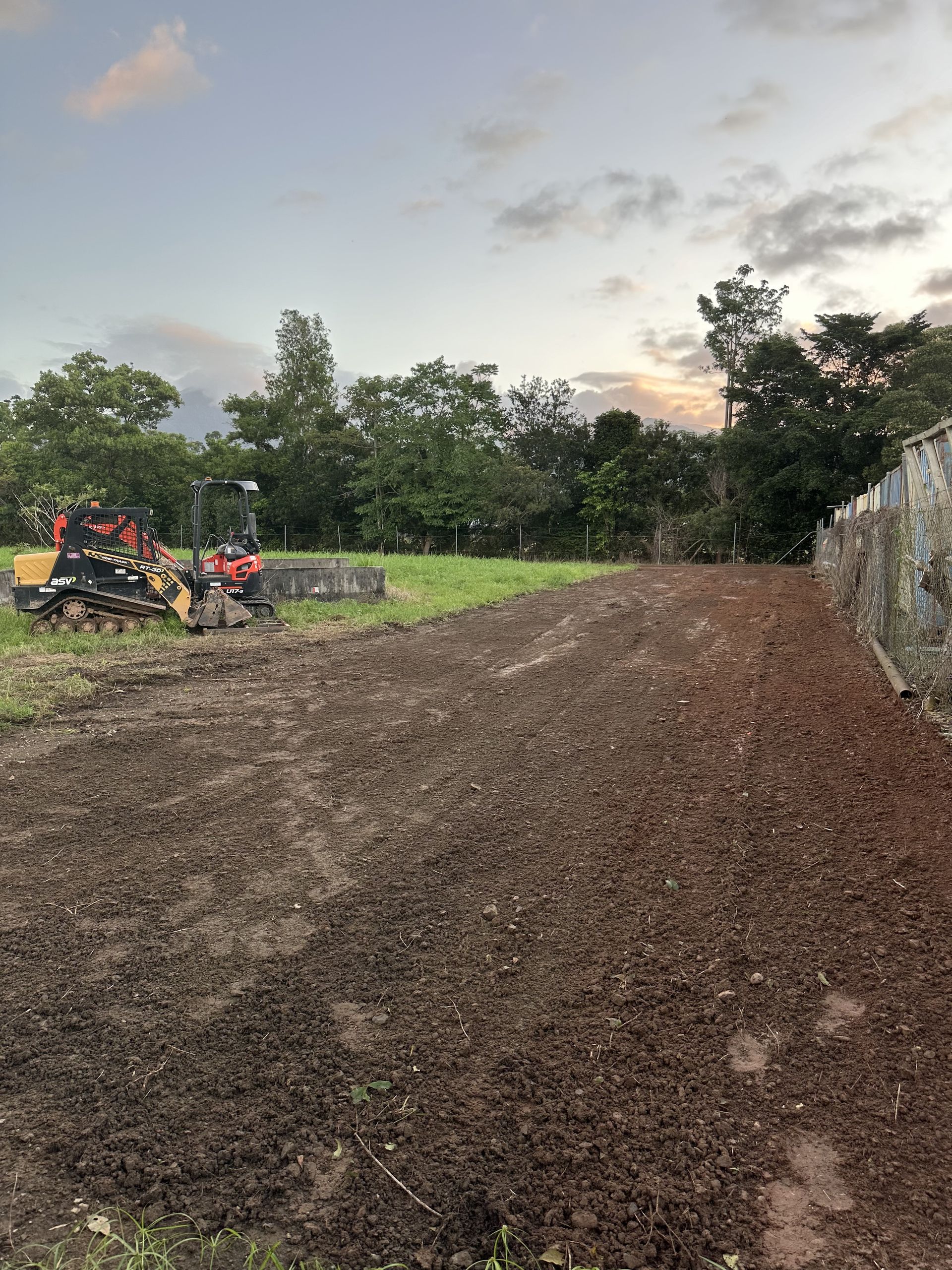 Yellow Excavator in a dirt field— Cairns Earthmoving Solutions In Holloways Beach, QLD