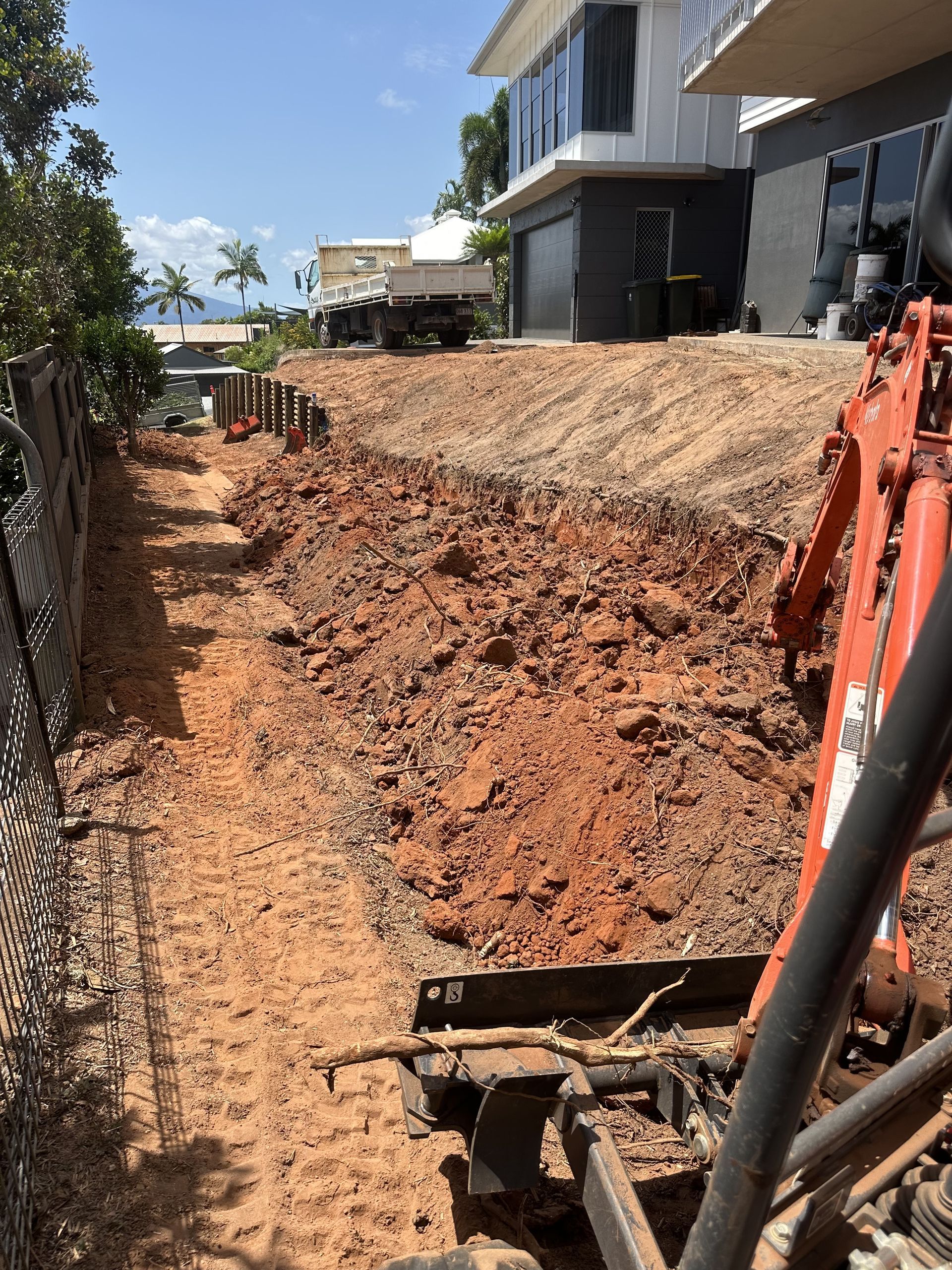 Yellow excavator claw in the sky — Cairns Earthmoving Solutions In Gordonvale, QLD