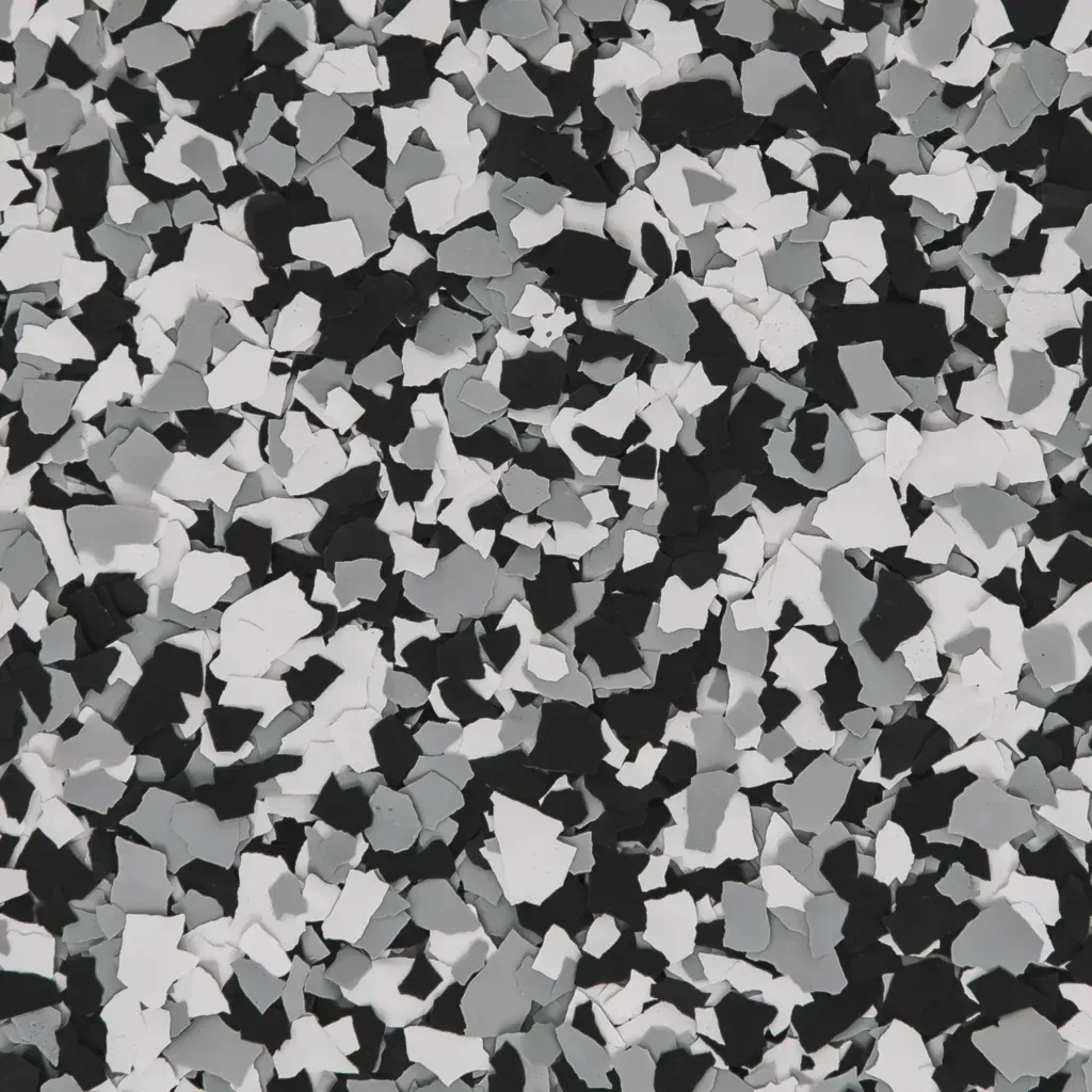 Black, white, and gray terrazzo-like mosaic pattern of scattered stone chips