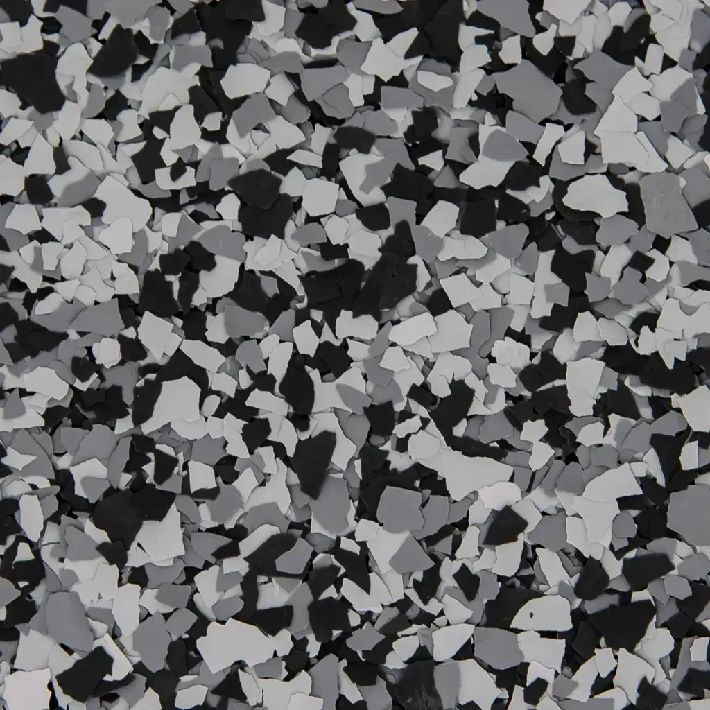 Black, gray, and white camouflage pattern of scattered leaf-like shapes