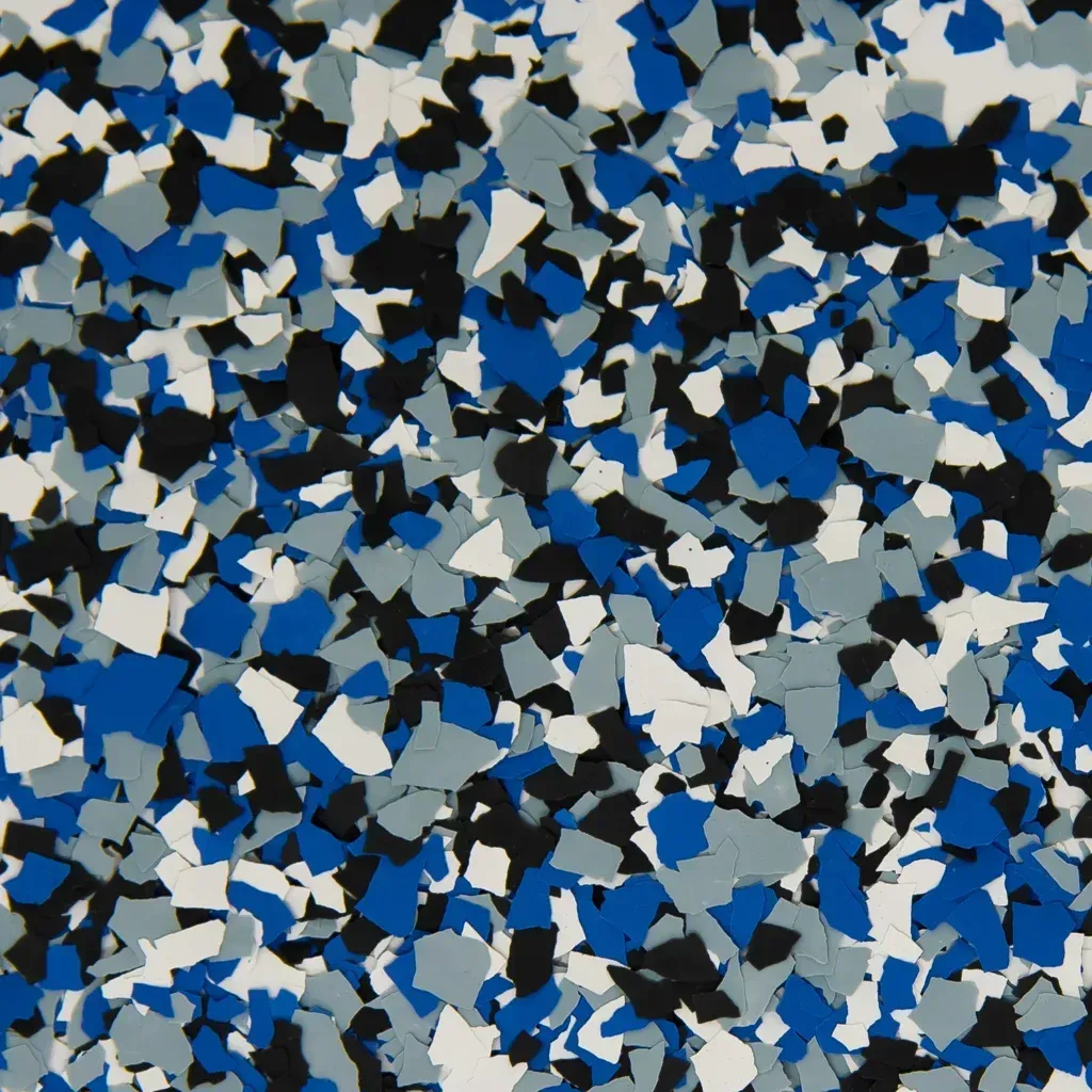 Abstract blue, white, gray, and black mosaic-like pattern of scattered confetti shapes