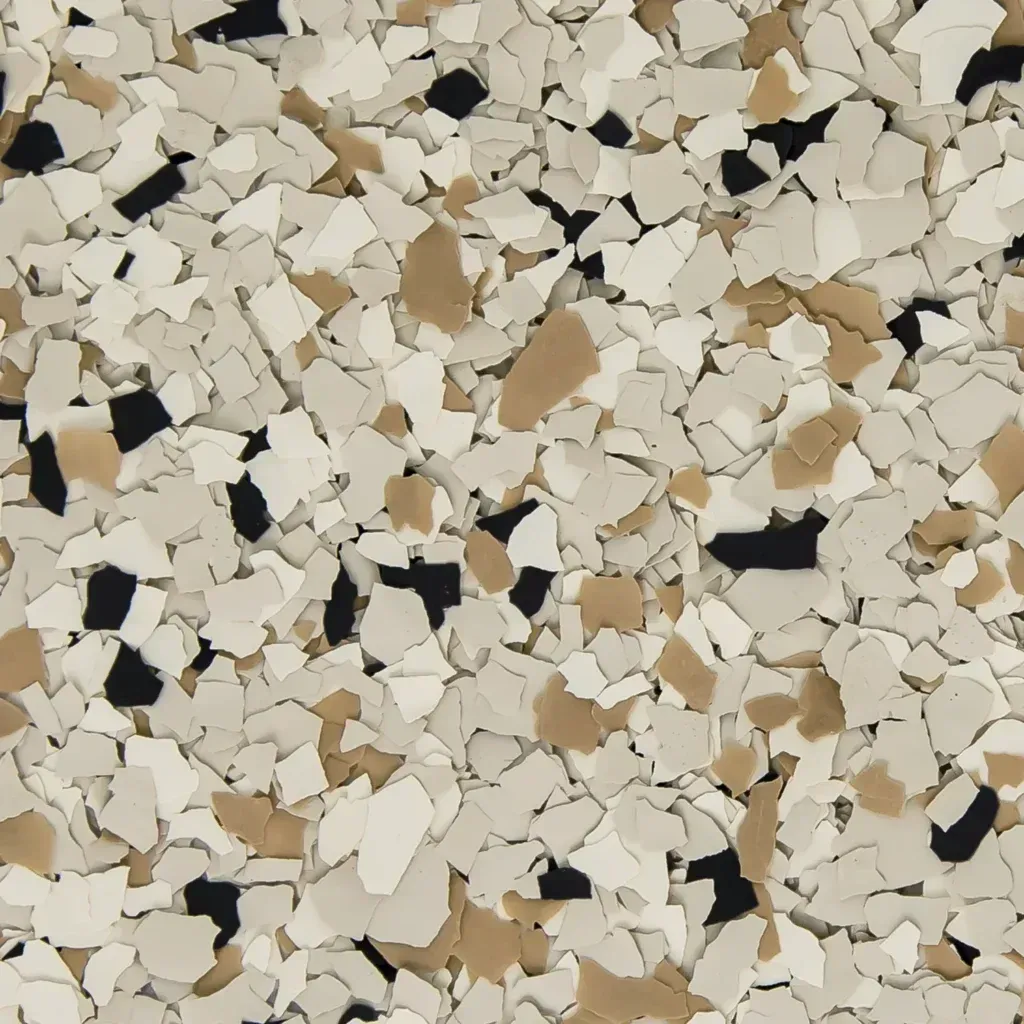 Close-up of small white, beige, and black stone chips scattered in a random pattern