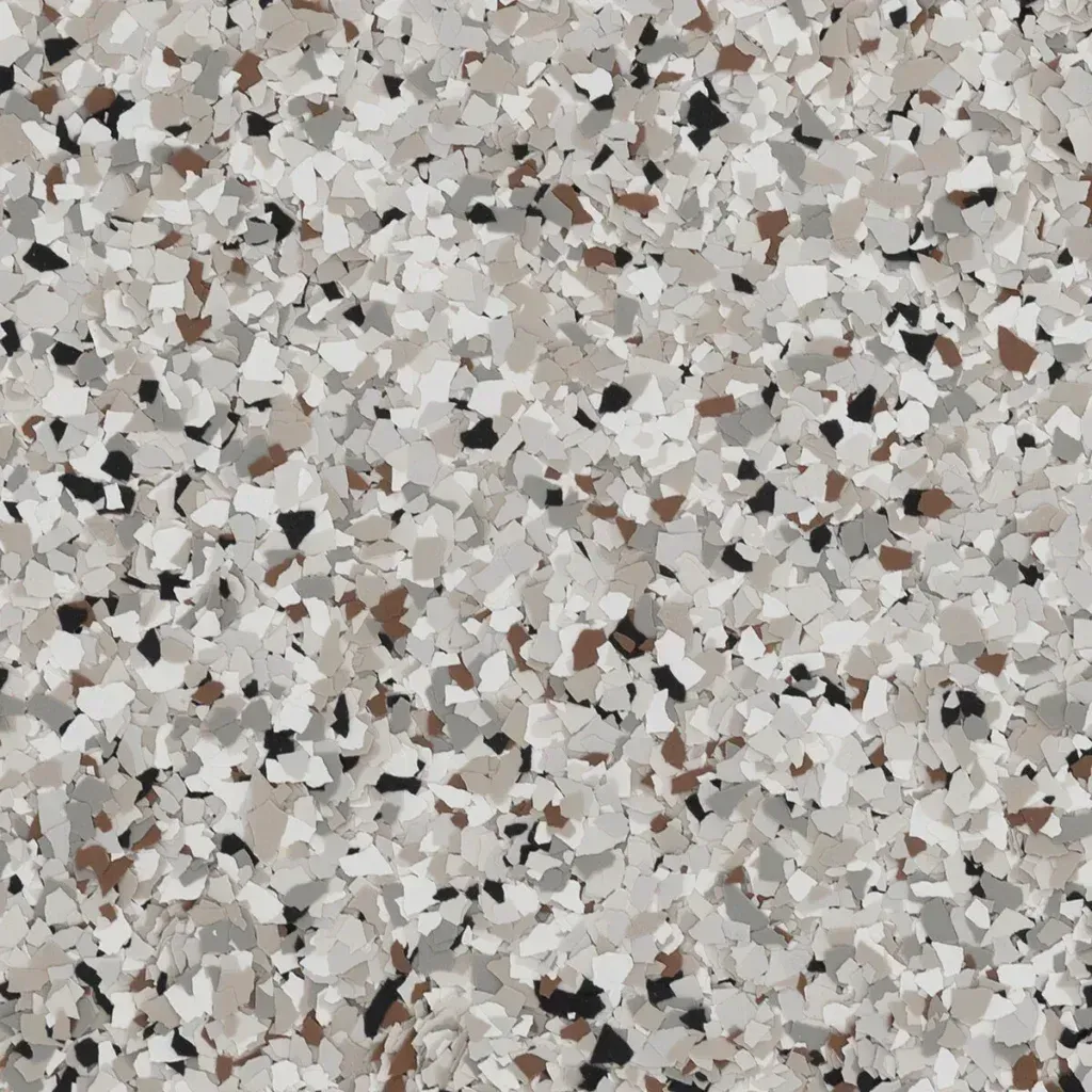 Speckled terrazzo surface with white, gray, beige, and dark stone chips