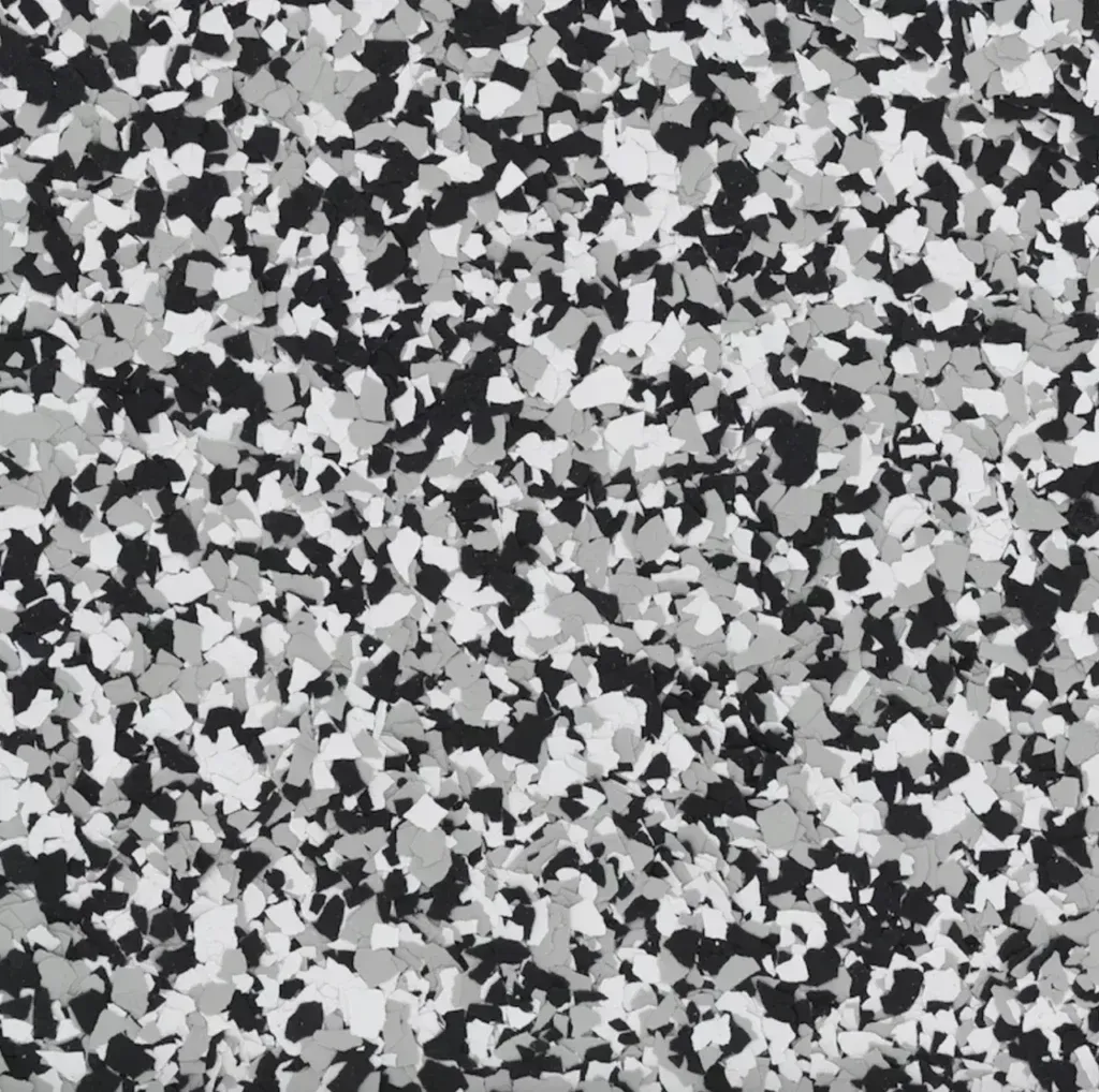 Gray, black, and white speckled abstract pattern resembling terrazzo or static noise