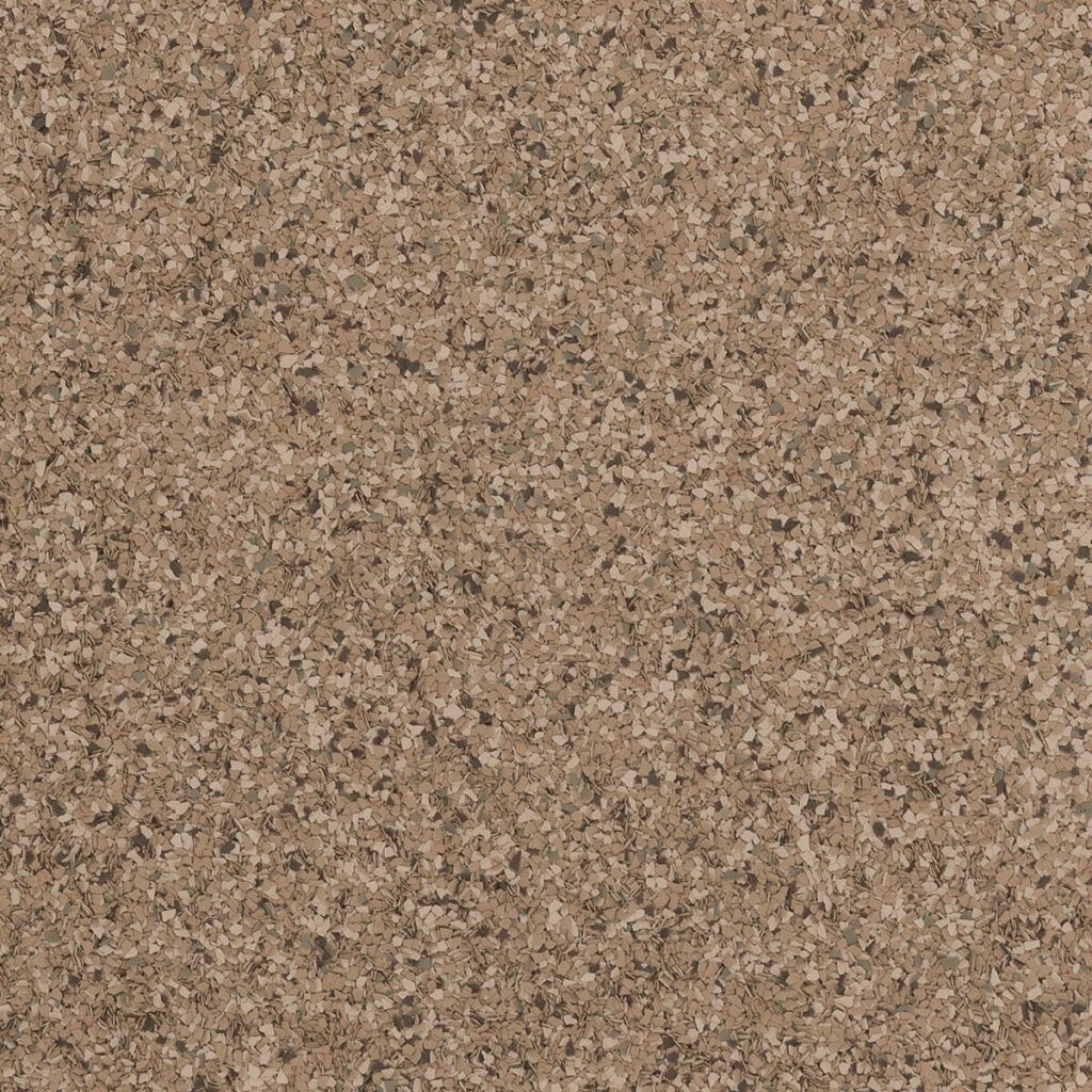 Close-up of a tan and brown speckled stone or granite surface