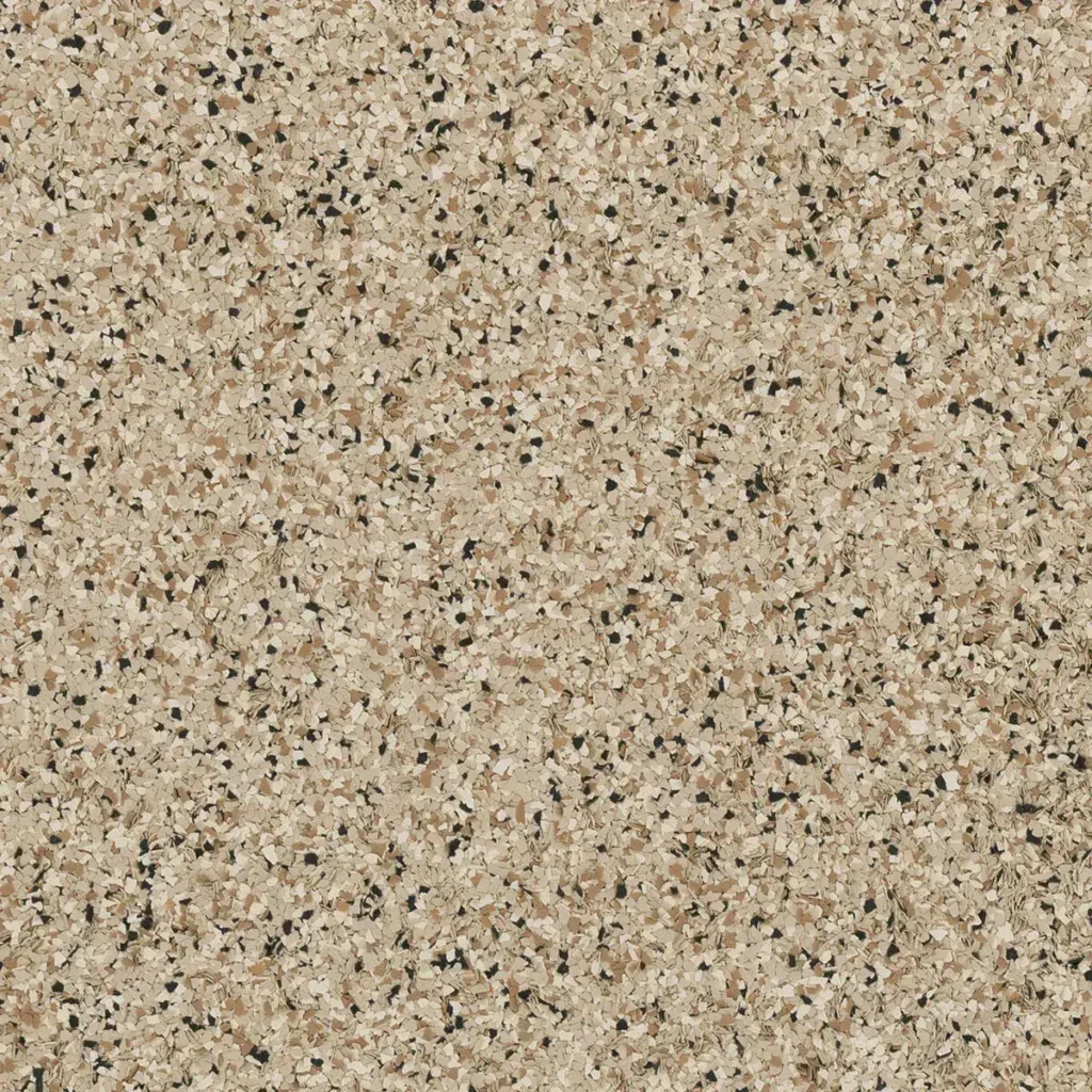 Close-up of a beige and tan speckled granite surface.