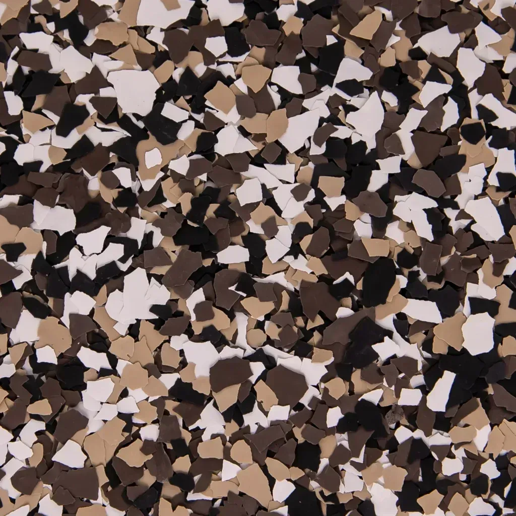 Abstract camouflage-like pattern of tan, brown, black, and white irregular shapes