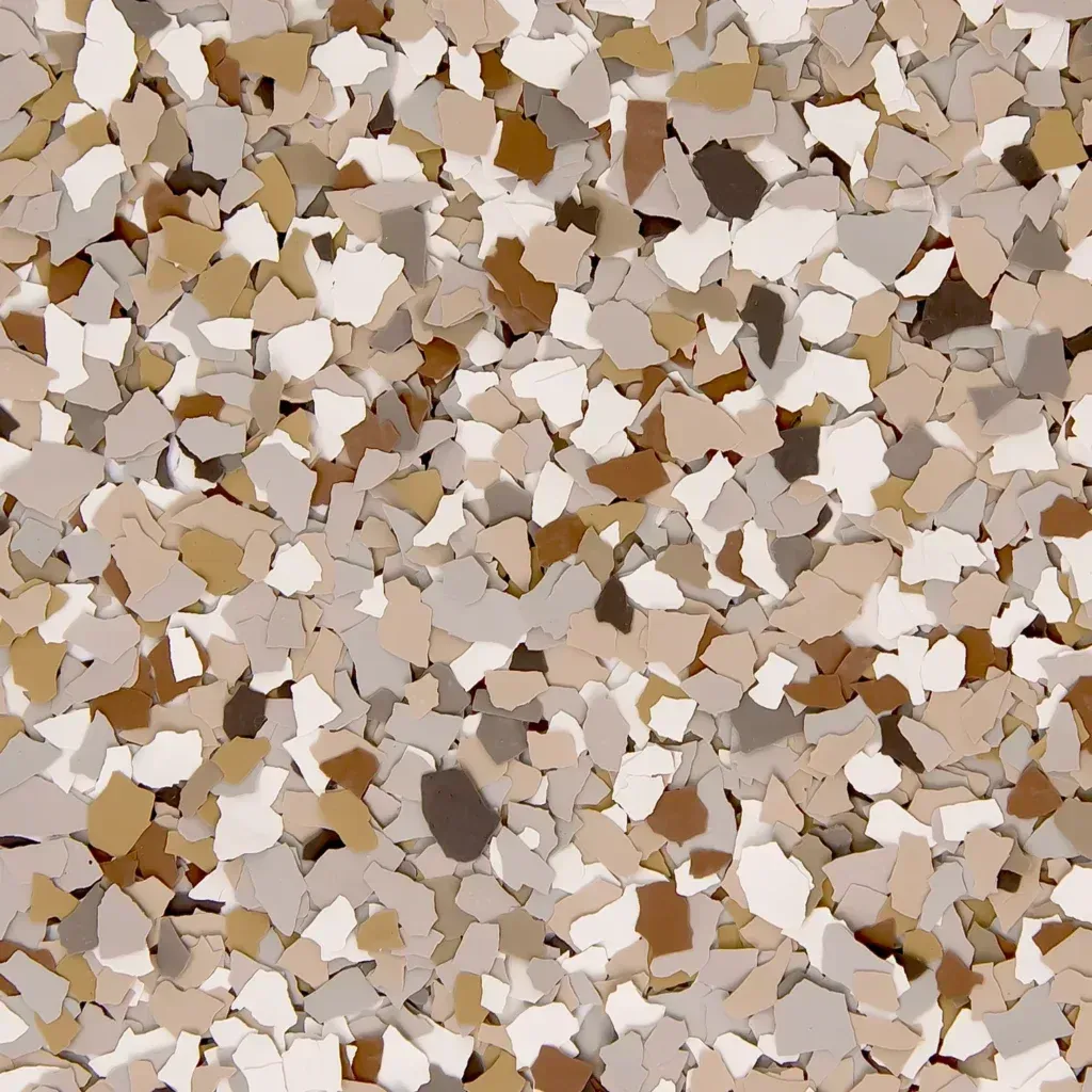 Abstract close-up of a beige, white, and brown speckled terrazzo-like surface