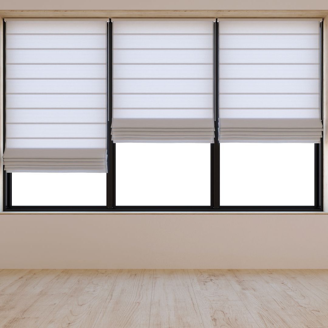 A room with three windows and roman blinds on them.