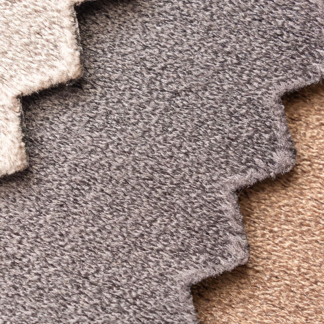 A close up of a piece of carpet on a table.