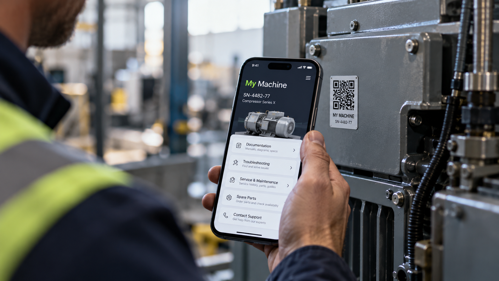 Worker holding smartphone to scan QR code on industrial equipment in a factory.