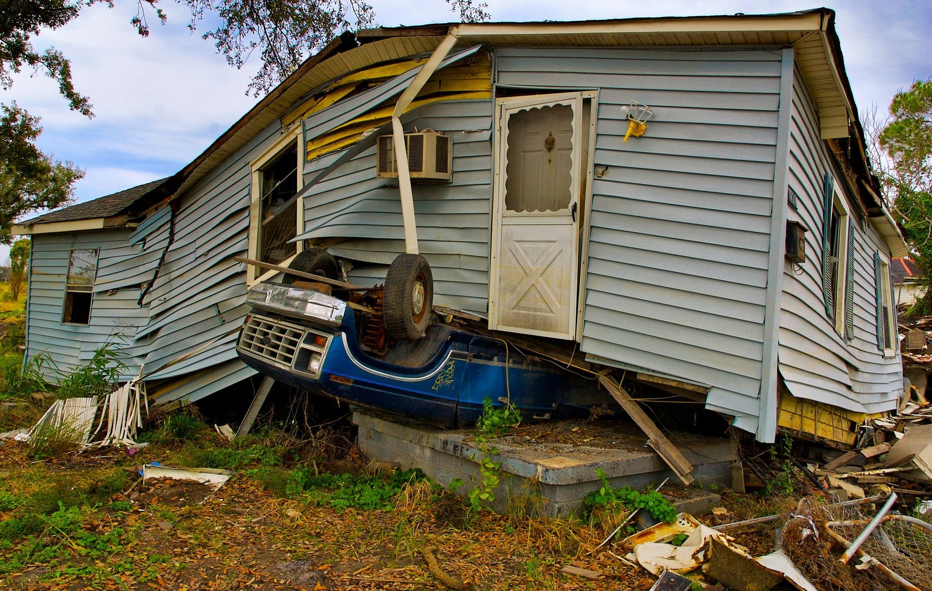 A house with a car on the side of it