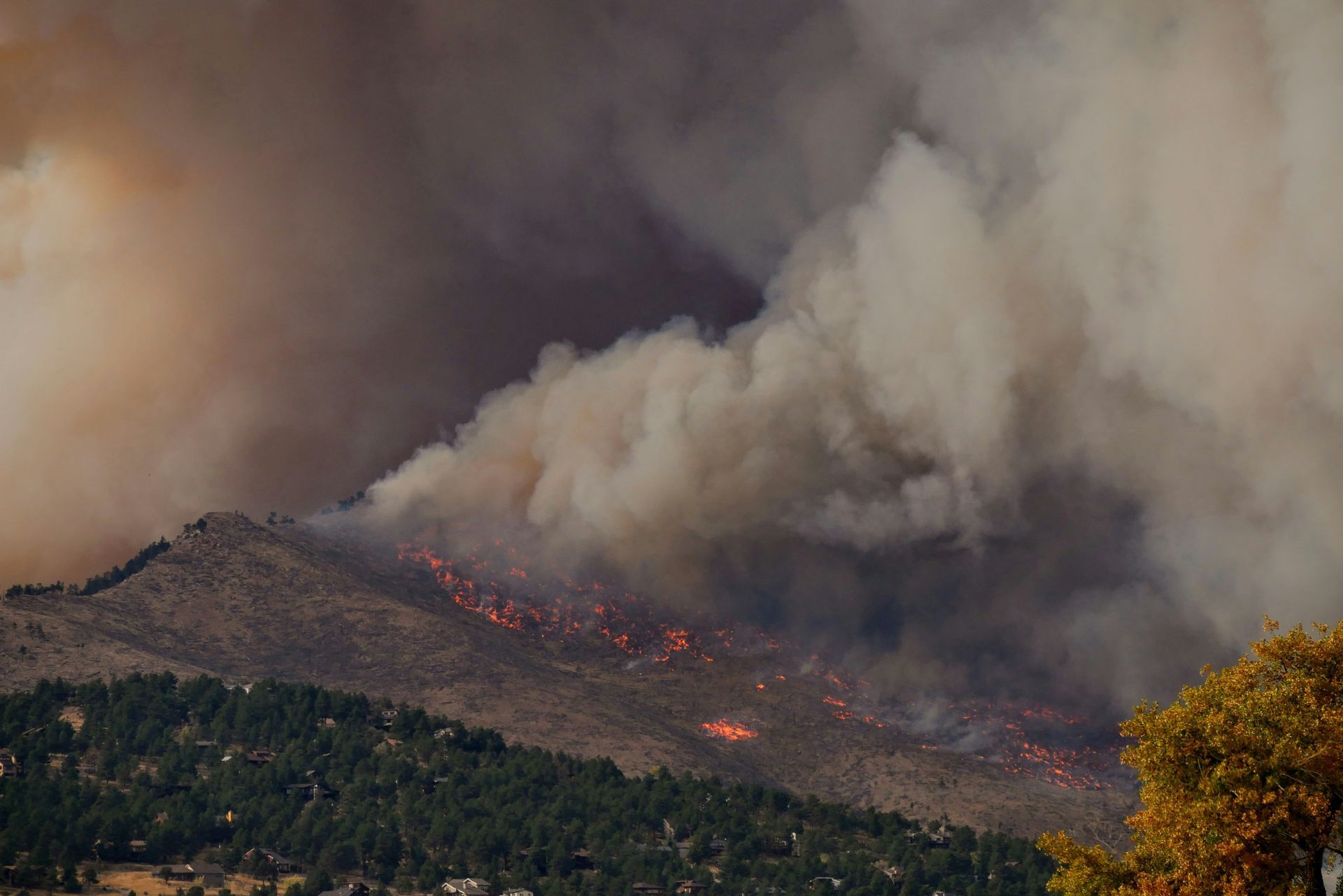 A mountain with a lot of smoke coming out of it.