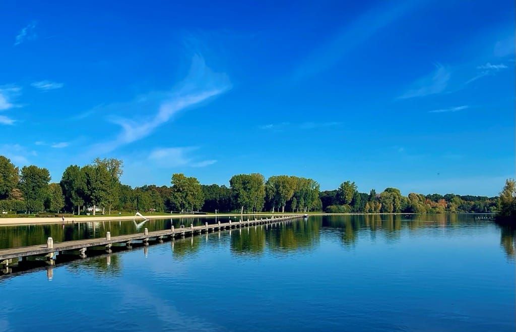 There is a dock in the middle of the lake.