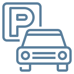 Um carro está estacionado em frente a uma placa de estacionamento.