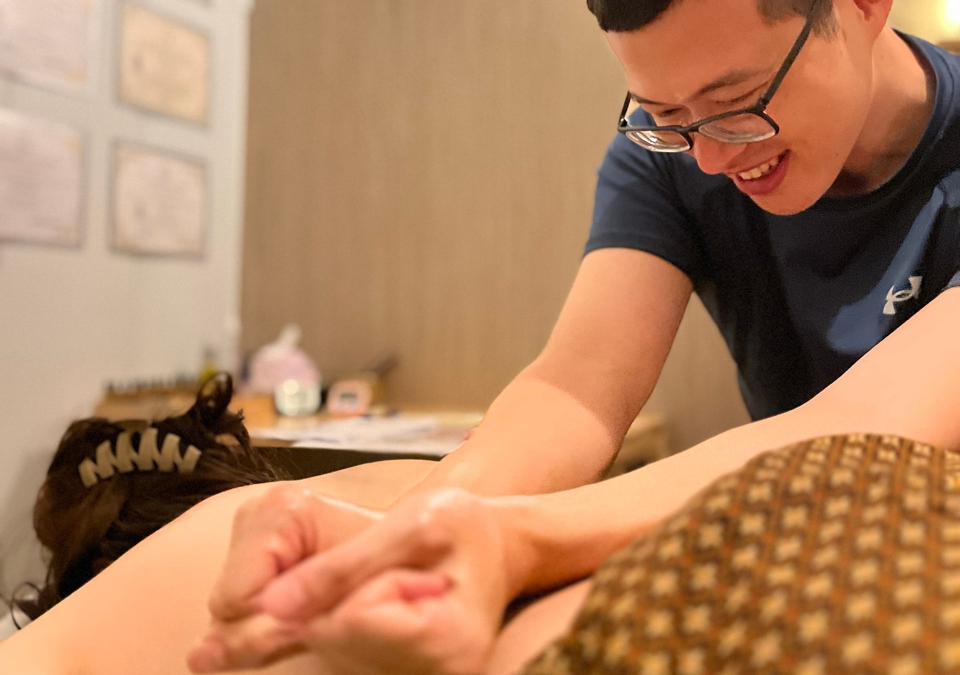 A man is giving a massage to a woman 's leg.
