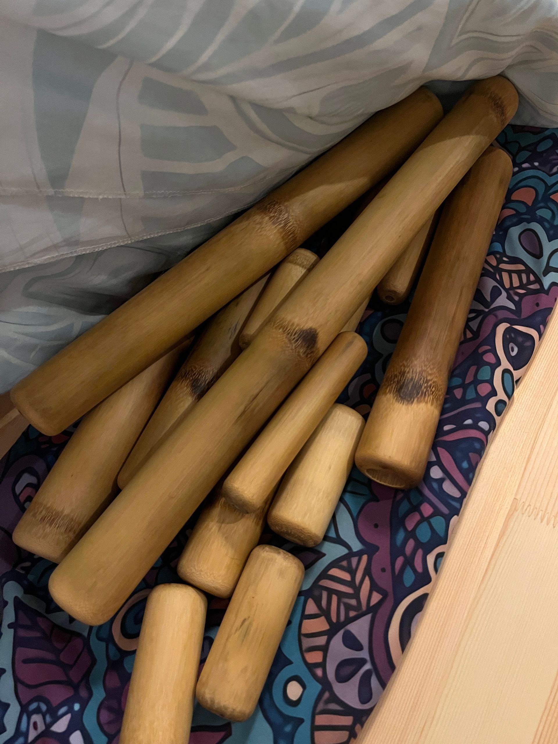 A bunch of bamboo sticks are sitting on a table