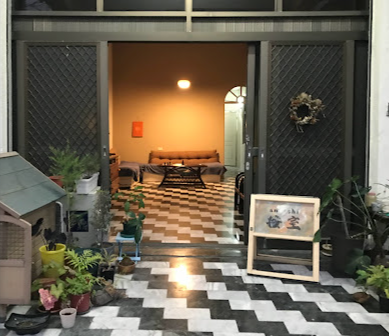 A room with a couch and a table in it