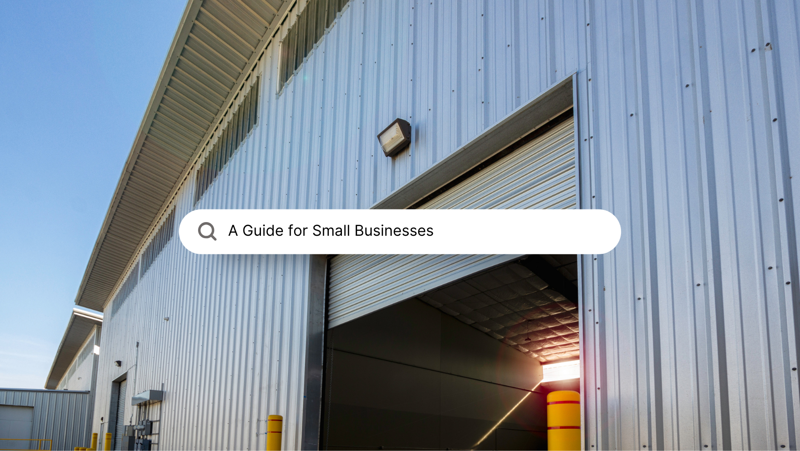 Warehouse with an open bay door, metallic siding, and text overlay reading 