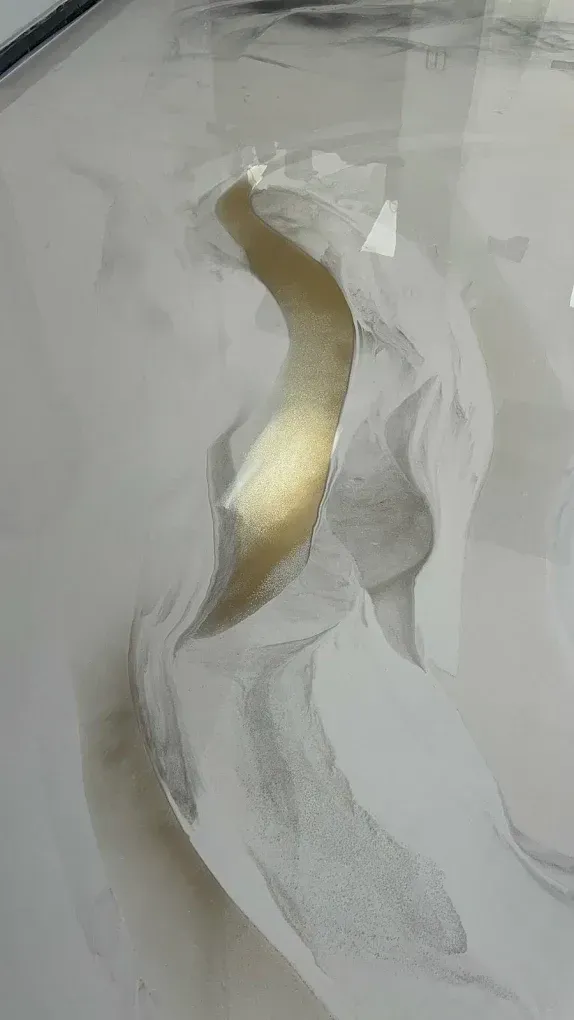 Abstract white and gray painting with a metallic gold vertical ribbon-like shape in the center