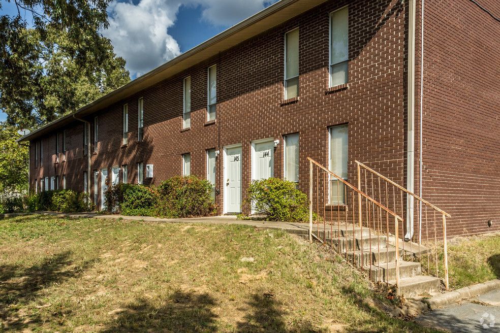 a brick apartment building with the number 34 on the door