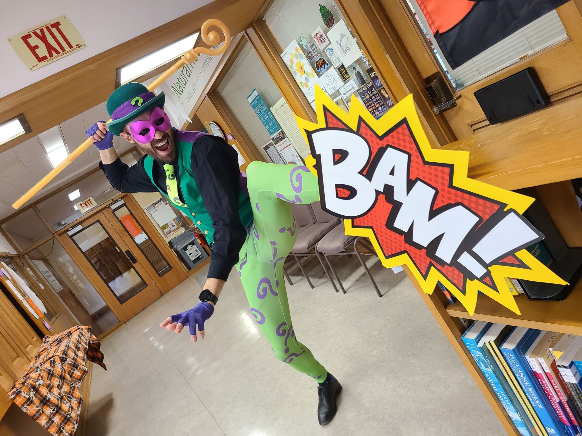 Man in Riddler costume kicks 