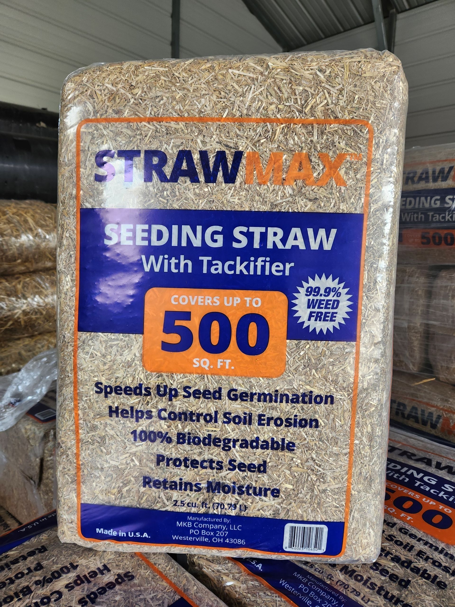 Stacked straw bale package labeled “STRAWMAX” and “SEEDING STRAW with Tackifier 500”