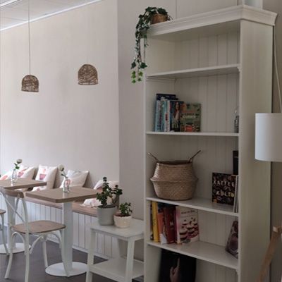 Book shelf and bistro tables.