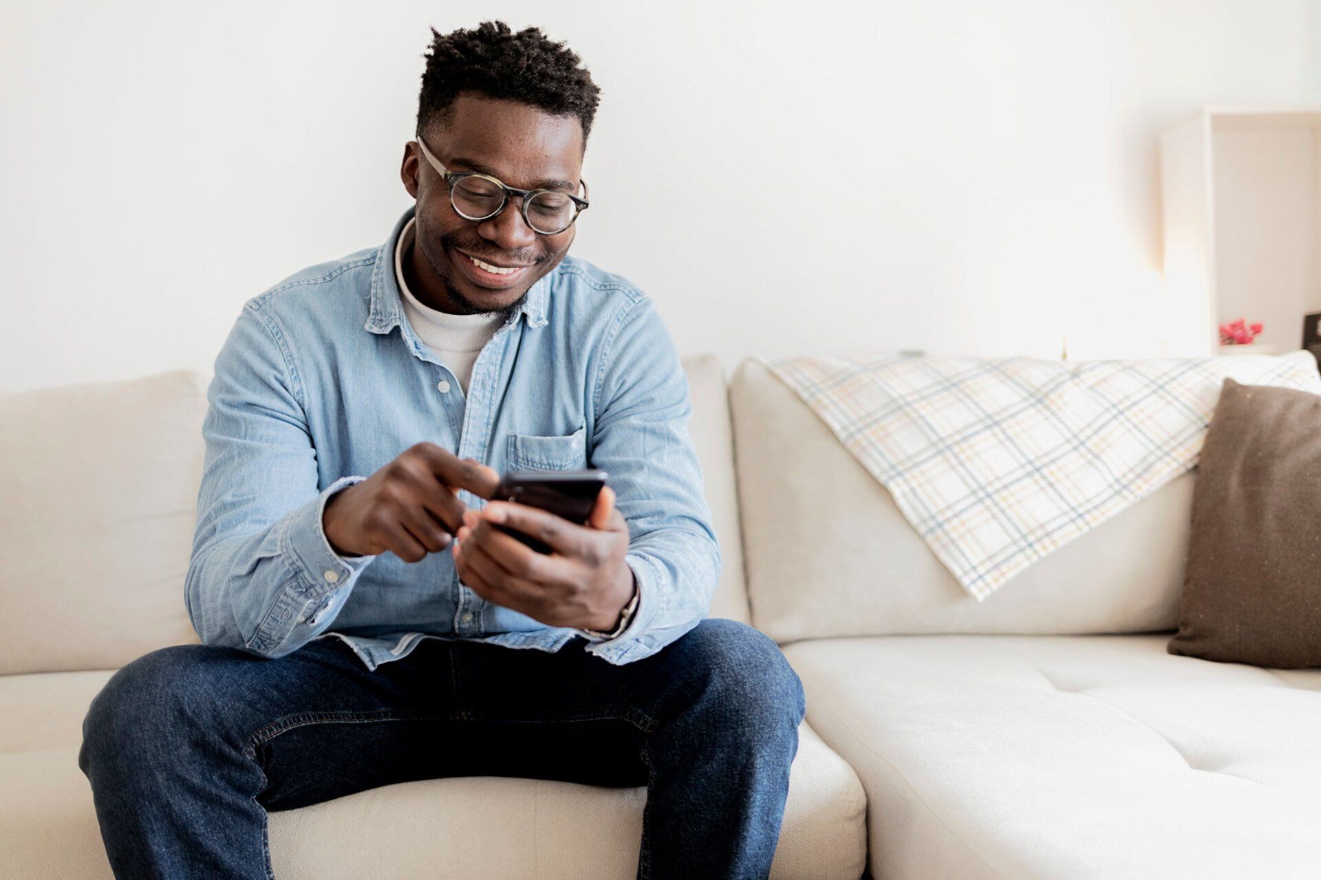 person using a cell phone - click to visit the contact page