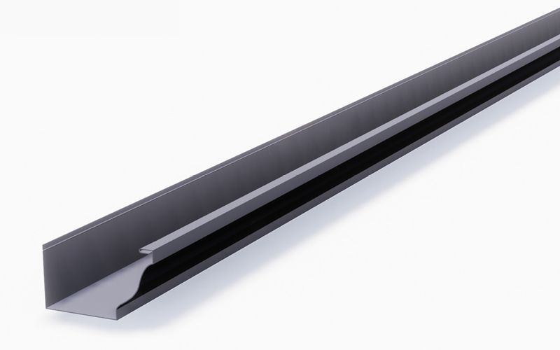 Gray metal rain gutter against a white background, showing the curved edge and flat base.