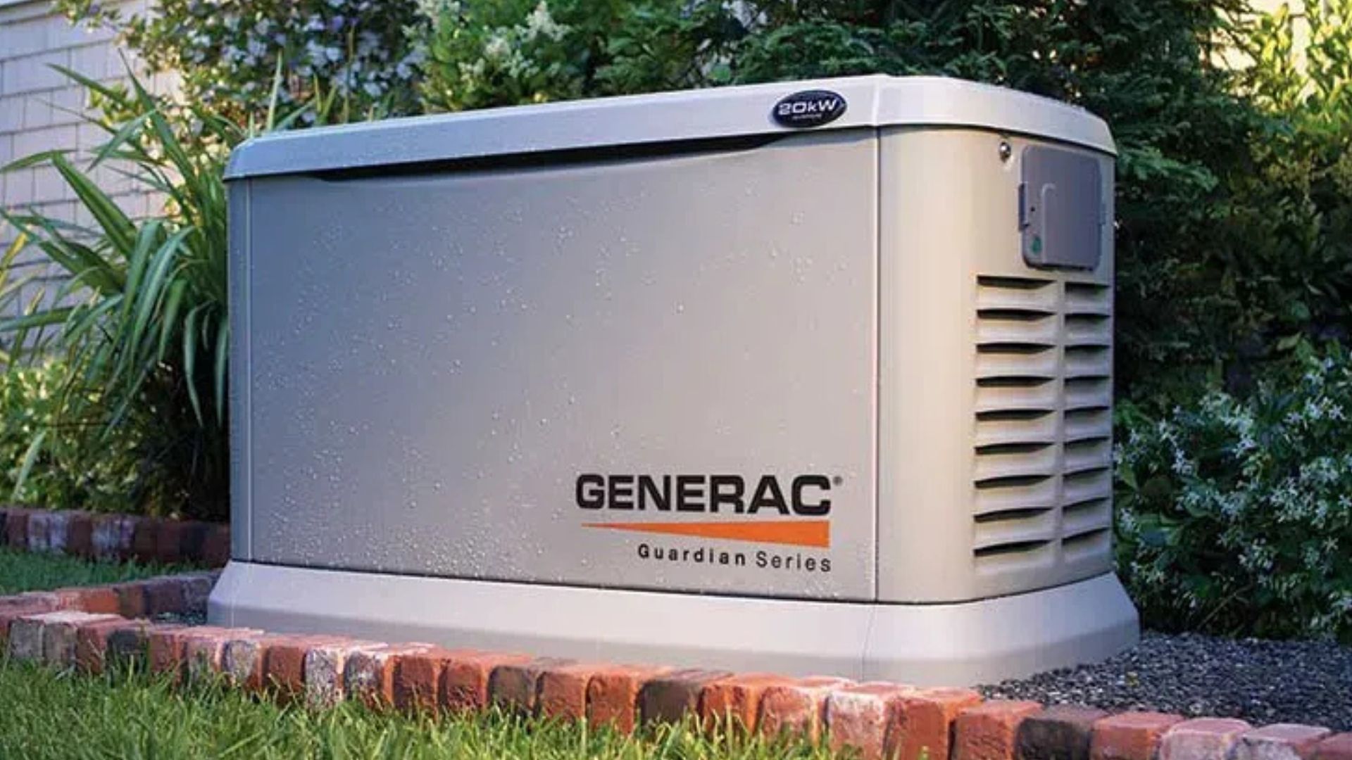 Generac home standby generator beside a brick walkway and green shrubs outdoors