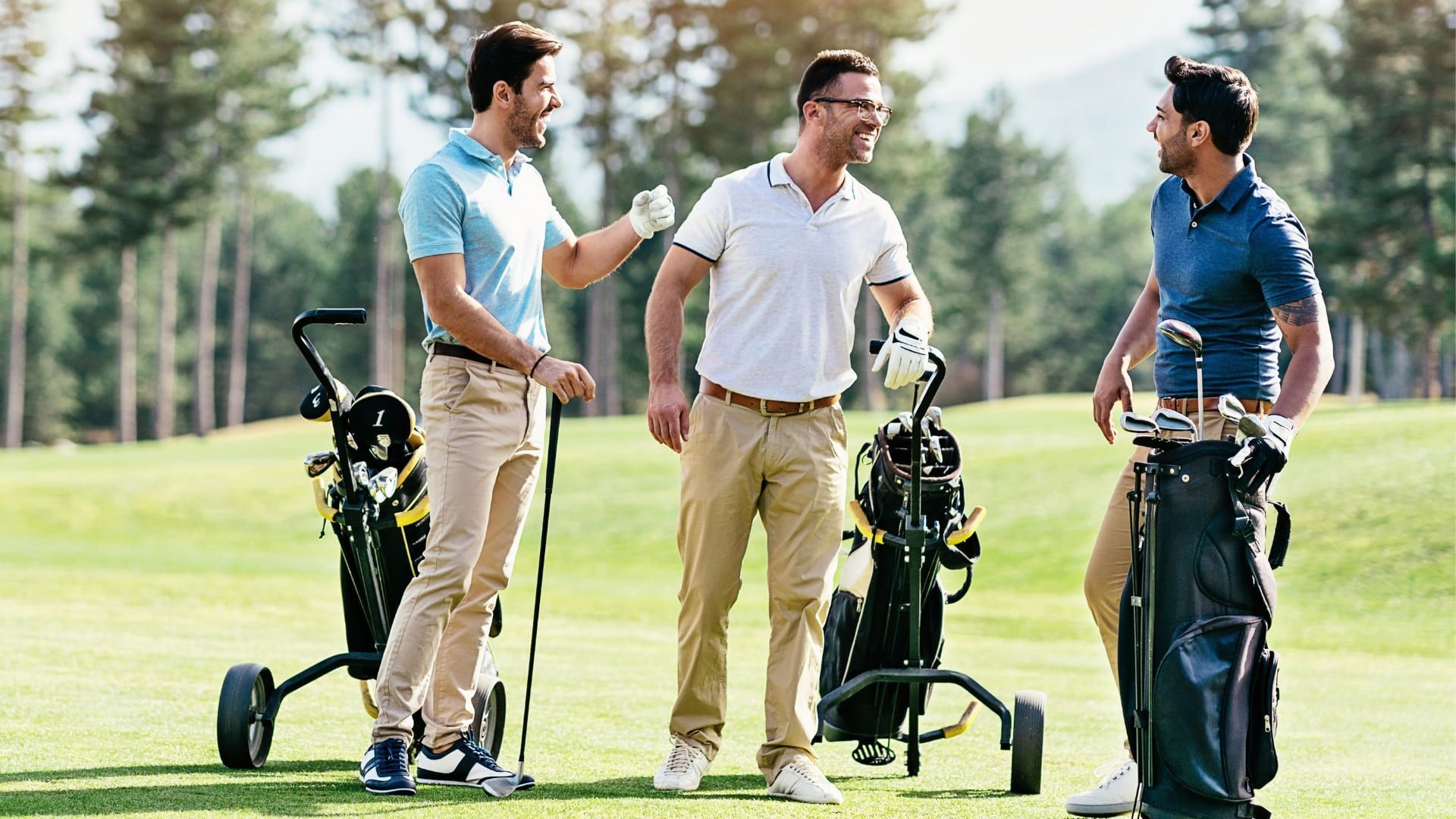 A group of men playing golf.