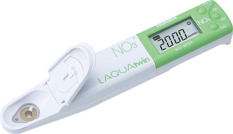 A digital thermometer with a green screen that says no3 on it
