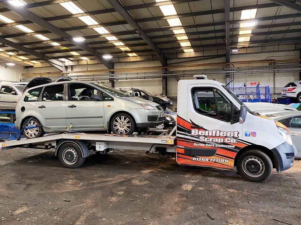 A scrap car on a Benfleet Scrap tow truck